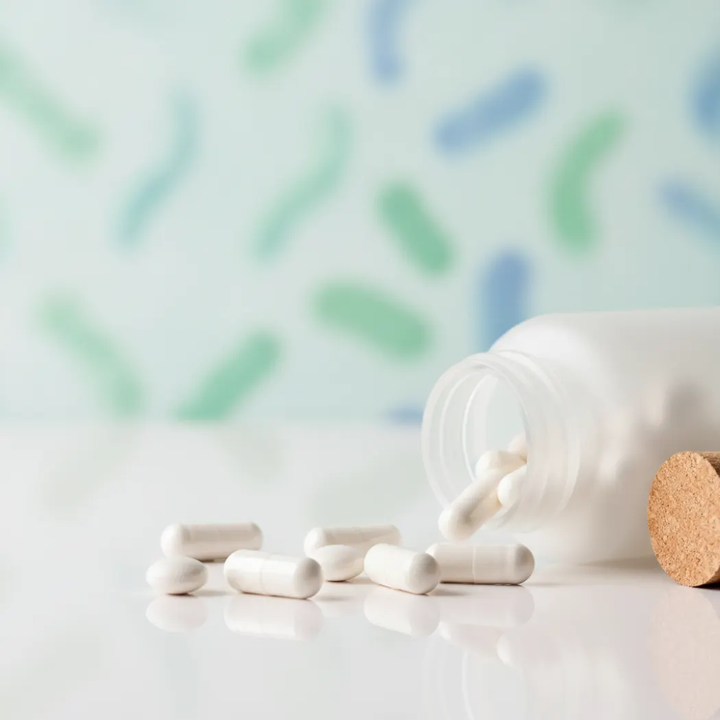 BetterVits Probiotic Complex capsules and gut microbiome illustration