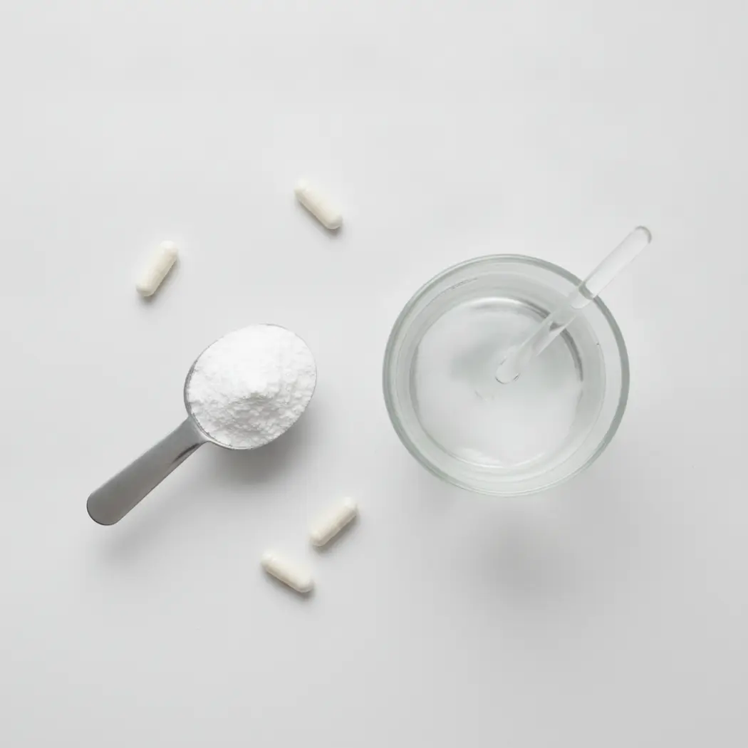 BodyHealth Gut Restore powder scooped and mixed into a glass of water